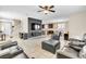 Spacious living room with tile flooring, modern TV setup, and comfortable seating at 1422 Ozzie Smith Ave, Henderson, NV 89074
