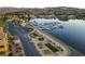 Aerial view of the lakefront community featuring a marina and beautifully landscaped common areas at 15 Via Mantova # 104, Henderson, NV 89011
