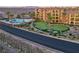 Aerial view featuring the community pool, putting green, and manicured grounds at 15 Via Mantova # 104, Henderson, NV 89011