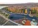 Aerial view showcasing community buildings, manicured landscaping, and scenic surroundings at 15 Via Mantova # 104, Henderson, NV 89011