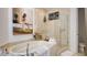 Luxurious bathroom with soaking tub, glass-enclosed shower, and stylish decor at 15 Via Mantova # 104, Henderson, NV 89011