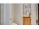 Toilet with a vanity in the bright and clean half-bathroom at 15 Via Mantova # 104, Henderson, NV 89011