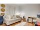 Bright bedroom with plush seating, desk and golf clubs at 15 Via Mantova # 104, Henderson, NV 89011