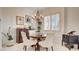 Cozy dining room with a round table, chandelier, and decorative furnishings at 15 Via Mantova # 104, Henderson, NV 89011