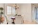 Charming dining area featuring a round wooden table and window shutters at 15 Via Mantova # 104, Henderson, NV 89011