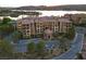 Beautiful condo building with manicured landscaping and ample parking spaces at 15 Via Mantova # 104, Henderson, NV 89011