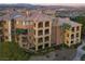 Luxury condos with private balconies, lush landscaping, and desert mountain views at 15 Via Mantova # 104, Henderson, NV 89011