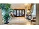 Grand entryway with marble floors, decorative doors, and elegant furnishings at 15 Via Mantova # 104, Henderson, NV 89011