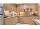 Stylish kitchen with updated countertops, stainless steel appliances, and ample cabinet space at 15 Via Mantova # 104, Henderson, NV 89011