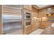 Modern kitchen featuring stainless steel appliances and custom cabinetry at 15 Via Mantova # 104, Henderson, NV 89011