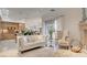 Cozy living room with a view of the kitchen and dining area, providing comfortable seating at 15 Via Mantova # 104, Henderson, NV 89011