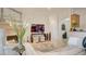 Bright living area with fireplace, marble floors, and stylish decor at 15 Via Mantova # 104, Henderson, NV 89011