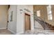 Elegant lobby with staircase, elevator, and sophisticated design elements at 15 Via Mantova # 104, Henderson, NV 89011