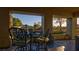 Enjoy an outdoor patio with seating that offers a serene view of trees and desert landscaping at 15 Via Mantova # 104, Henderson, NV 89011