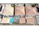 Aerial view of homes in a neighborhood, featuring backyard pools, and terracotta colored roofs at 1730 Juniper Twig Ave, Las Vegas, NV 89183