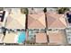 Aerial view of homes in a neighborhood, featuring backyard pools, and terracotta colored roofs at 1730 Juniper Twig Ave, Las Vegas, NV 89183