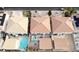 Aerial view of homes in a neighborhood, featuring backyard pools, and terracotta colored roofs at 1730 Juniper Twig Ave, Las Vegas, NV 89183