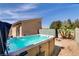 Backyard featuring spa, patio, and mature trees, creating a tranquil retreat at 1730 Juniper Twig Ave, Las Vegas, NV 89183