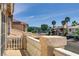 Charming balcony view overlooking a quiet street with palm trees and well-maintained houses at 1730 Juniper Twig Ave, Las Vegas, NV 89183