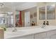 Bathroom with double sinks with mirror view into main bedroom at 1730 Juniper Twig Ave, Las Vegas, NV 89183