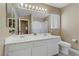 Bright bathroom with double vanity, large mirror, updated fixtures, and a convenient toilet and shower area at 1730 Juniper Twig Ave, Las Vegas, NV 89183