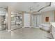 Large bathroom with double sinks, bathtub, shower, and tile flooring throughout at 1730 Juniper Twig Ave, Las Vegas, NV 89183