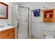Clean bathroom featuring a glass-enclosed shower and a vanity sink at 1730 Juniper Twig Ave, Las Vegas, NV 89183