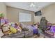 This bedroom offers space to relax, study, or play games with plenty of stuffed animal friends at 1730 Juniper Twig Ave, Las Vegas, NV 89183