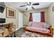 Cozy bedroom, perfect for work and relaxation, with a futon and ample desk space at 1730 Juniper Twig Ave, Las Vegas, NV 89183