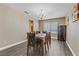 Bright dining room with a chandelier and wood-look flooring, perfect for gatherings at 1730 Juniper Twig Ave, Las Vegas, NV 89183