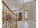 Welcoming entryway with tile floors, coat rack, and natural light filtering through an oval-glass door at 1730 Juniper Twig Ave, Las Vegas, NV 89183