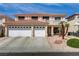 Inviting two-story home with a terracotta-tiled roof and a convenient two-car garage at 1730 Juniper Twig Ave, Las Vegas, NV 89183