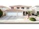 Charming two-story home with a spacious driveway, two-car garage and beautiful desert landscaping at 1730 Juniper Twig Ave, Las Vegas, NV 89183
