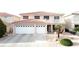 Charming two-story home with a three car garage and a small second story balcony at 1730 Juniper Twig Ave, Las Vegas, NV 89183