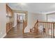 Bright hallway with hardwood floors, wood trim, and an overlooking view from the second floor at 1730 Juniper Twig Ave, Las Vegas, NV 89183