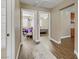 Spacious hallway features wood flooring, neutral walls, and doorways leading to a bedroom and other rooms at 1730 Juniper Twig Ave, Las Vegas, NV 89183