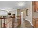 Hallway with hardwood floors, featuring an arched alcove, and leading to other rooms in the house at 1730 Juniper Twig Ave, Las Vegas, NV 89183