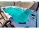 Backyard view of a hot tub with turquoise water at 1730 Juniper Twig Ave, Las Vegas, NV 89183