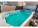 Backyard hot tub with turquoise water and a view of the surrounding landscape at 1730 Juniper Twig Ave, Las Vegas, NV 89183