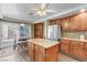 Bright kitchen with island, stainless fridge, and access to outdoor dining at 1730 Juniper Twig Ave, Las Vegas, NV 89183