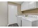 Convenient laundry room featuring a full-size washer and dryer for easy laundry care at 1730 Juniper Twig Ave, Las Vegas, NV 89183
