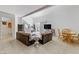 Open-concept living area with comfortable seating and access to outdoor space at 1730 Juniper Twig Ave, Las Vegas, NV 89183