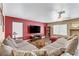 Inviting living room with a cozy sectional sofa and modern television at 1730 Juniper Twig Ave, Las Vegas, NV 89183