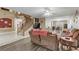 Spacious living room with an open layout, adjacent to a staircase and dining area at 1730 Juniper Twig Ave, Las Vegas, NV 89183