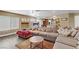 Spacious living room featuring a fireplace, a large comfortable sectional sofa, and modern decor at 1730 Juniper Twig Ave, Las Vegas, NV 89183