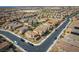This is an aerial view of houses in a neighborhood, and winding streets at 1819 Wild Grain Ave, North Las Vegas, NV 89086