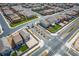 Scenic aerial view of a neighborhood intersection with well-manicured lawns, trees, and organized street layout at 1819 Wild Grain Ave, North Las Vegas, NV 89086