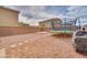 Low maintenance backyard featuring gravel, a trampoline and a stone paver path at 1819 Wild Grain Ave, North Las Vegas, NV 89086