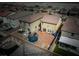 Aerial view of a backyard featuring a trampoline, patio area, and secure fencing for privacy at 1819 Wild Grain Ave, North Las Vegas, NV 89086