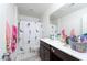 Bathroom featuring a single vanity, toilet and tub with mermaid shower curtain at 1819 Wild Grain Ave, North Las Vegas, NV 89086